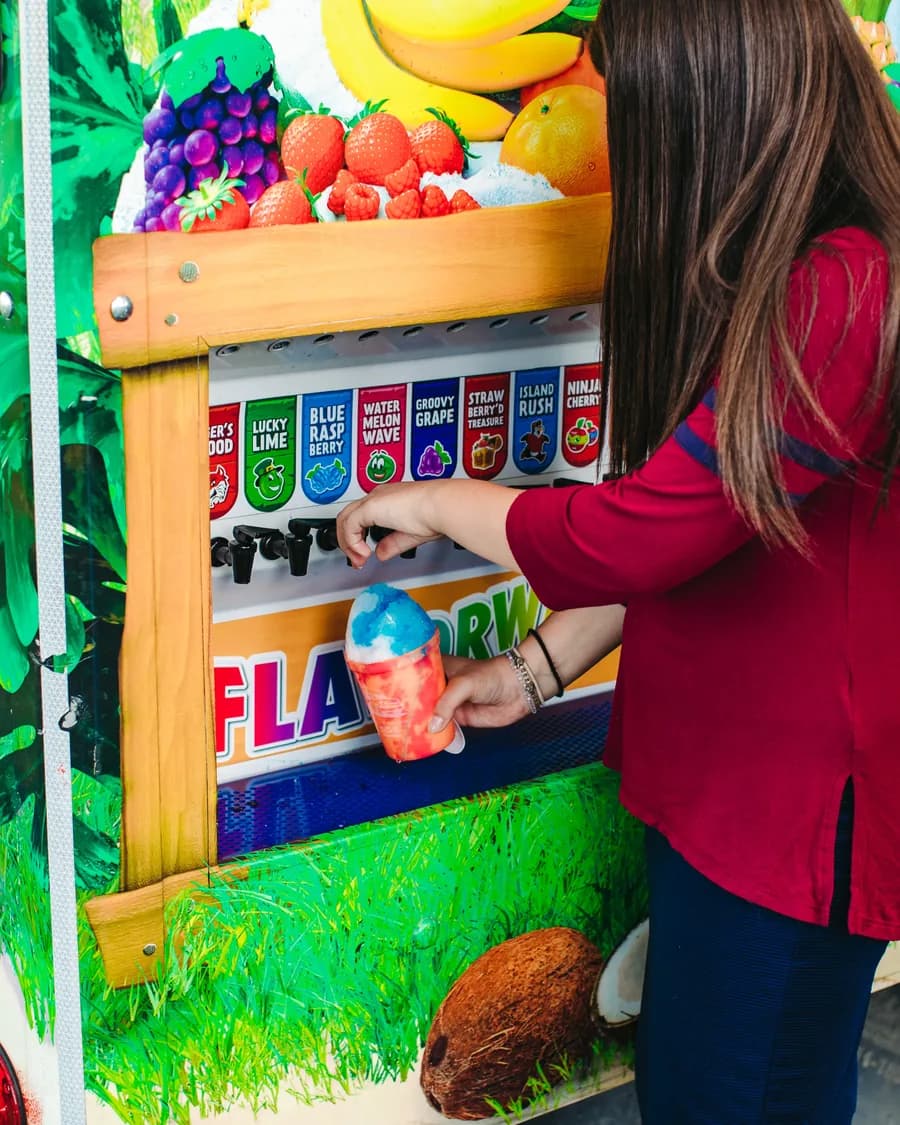 A guest pouring flavors at the Kona Ice Flavorwave